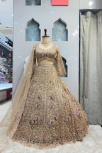 "GOLDEN BLUSH PEACOCK ROYALE LEHENGA" image 0