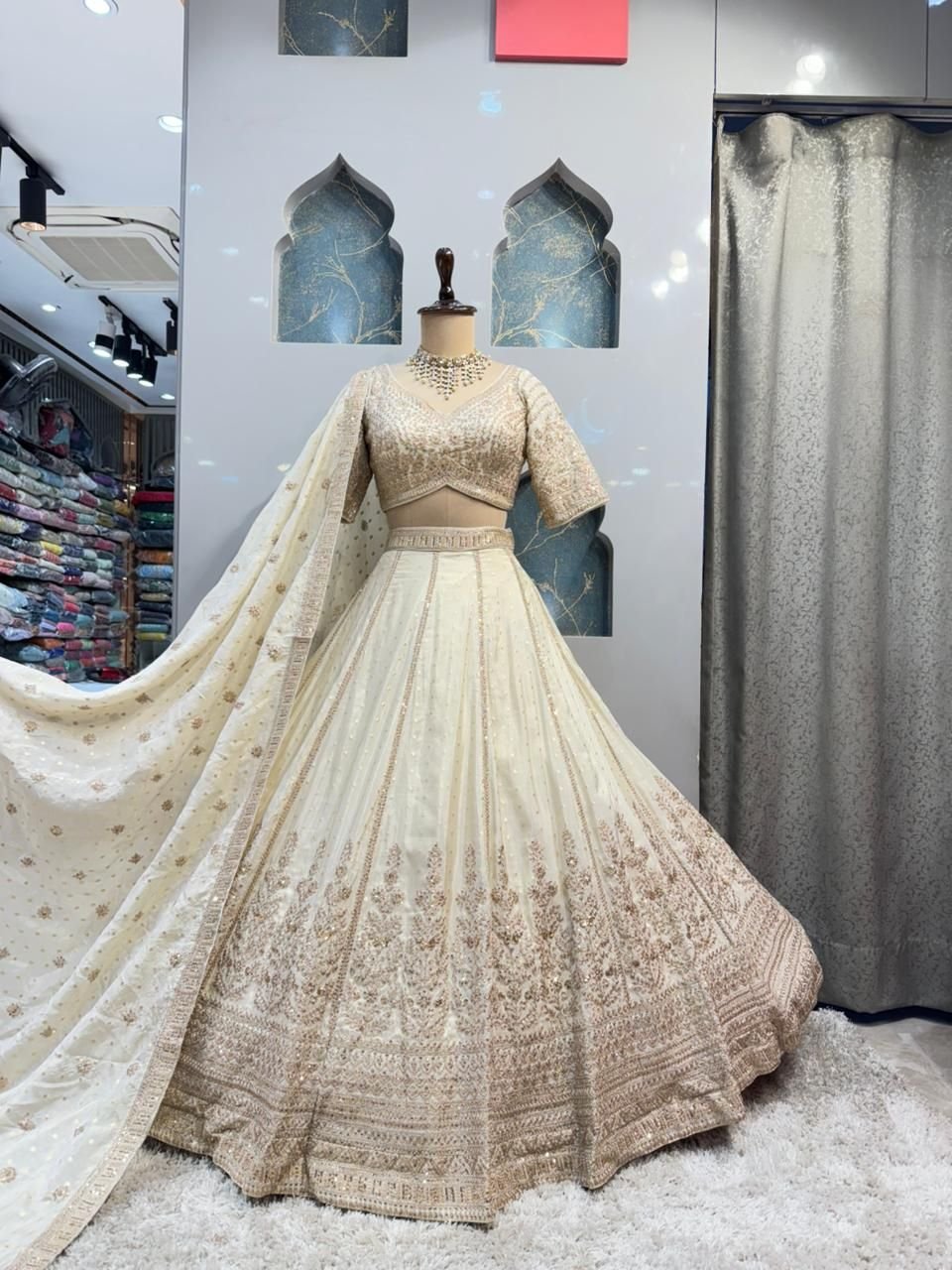 "ETHEREAL CREAM AND GOLD LEHENGA" image 0