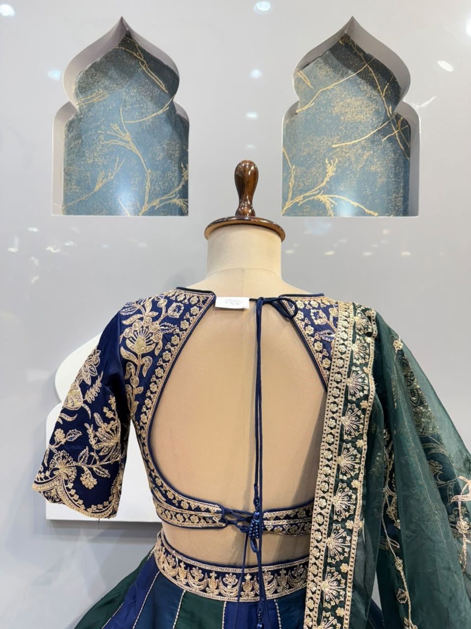 "REGAL BLUE AND EMERALD GREEN LEHENGA"