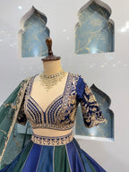 "REGAL BLUE AND EMERALD GREEN LEHENGA"