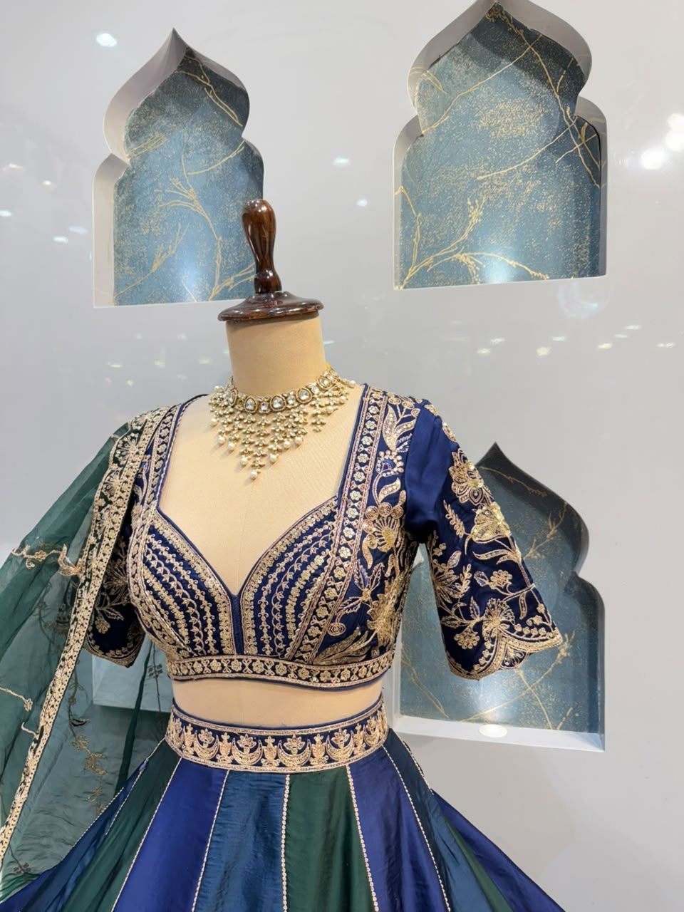 "REGAL BLUE AND EMERALD GREEN LEHENGA"