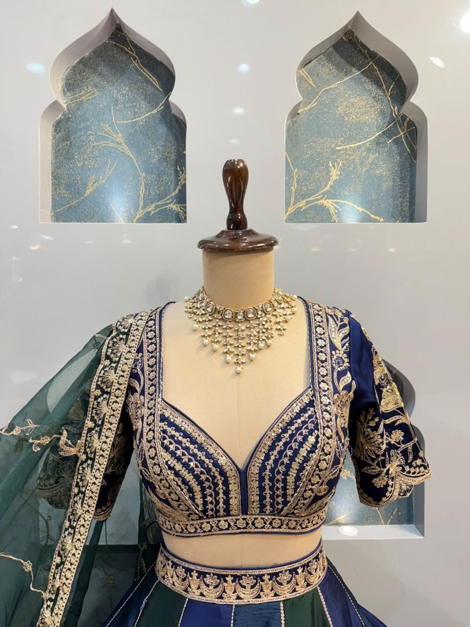 "REGAL BLUE AND EMERALD GREEN LEHENGA"