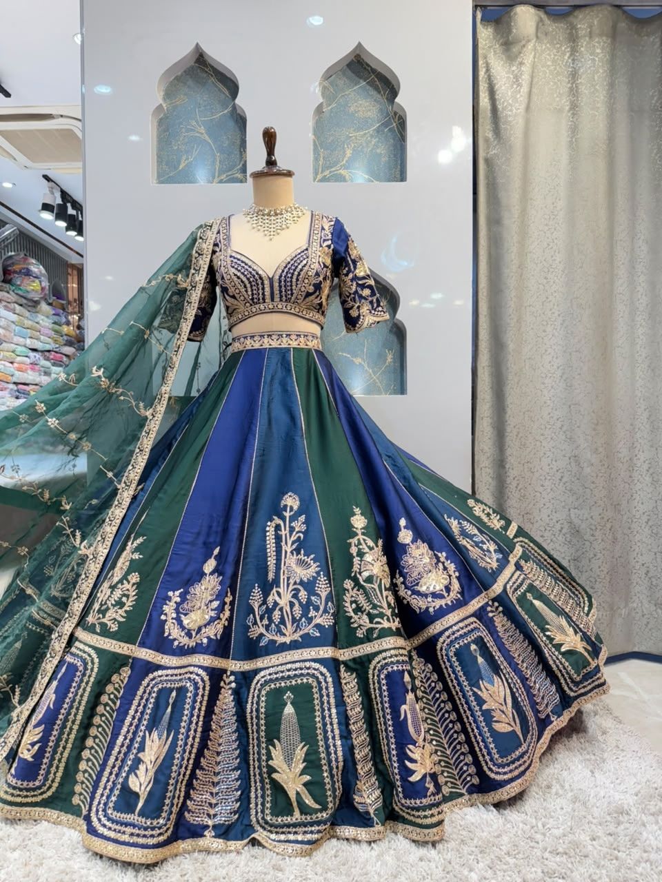 "REGAL BLUE AND EMERALD GREEN LEHENGA"