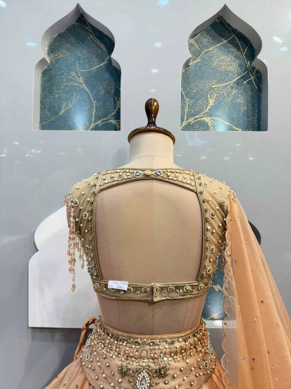 "PEACH PEARL EMBELLISHED ROYAL LEHENGA"