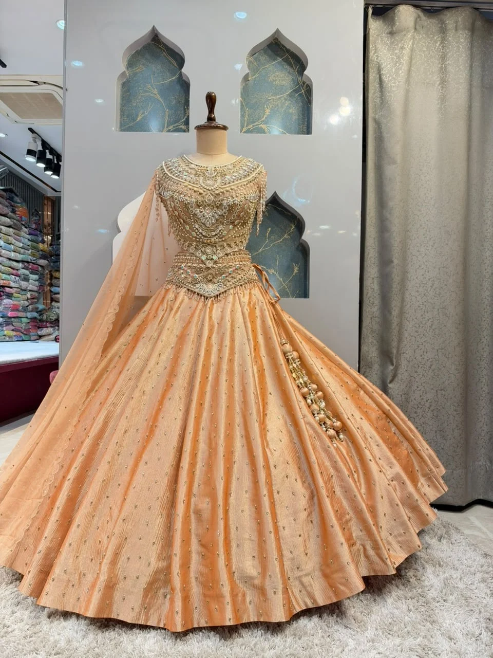 "PEACH PEARL EMBELLISHED ROYAL LEHENGA"
