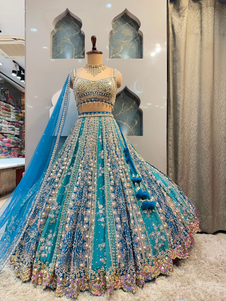 "AQUA BLUE AND SILVER EMBROIDERED LEHENGA"