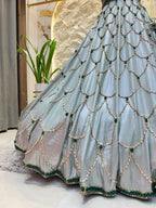 "ICY BLUE & EMERALD GREEN SCAPPLOPED LEHENGA"