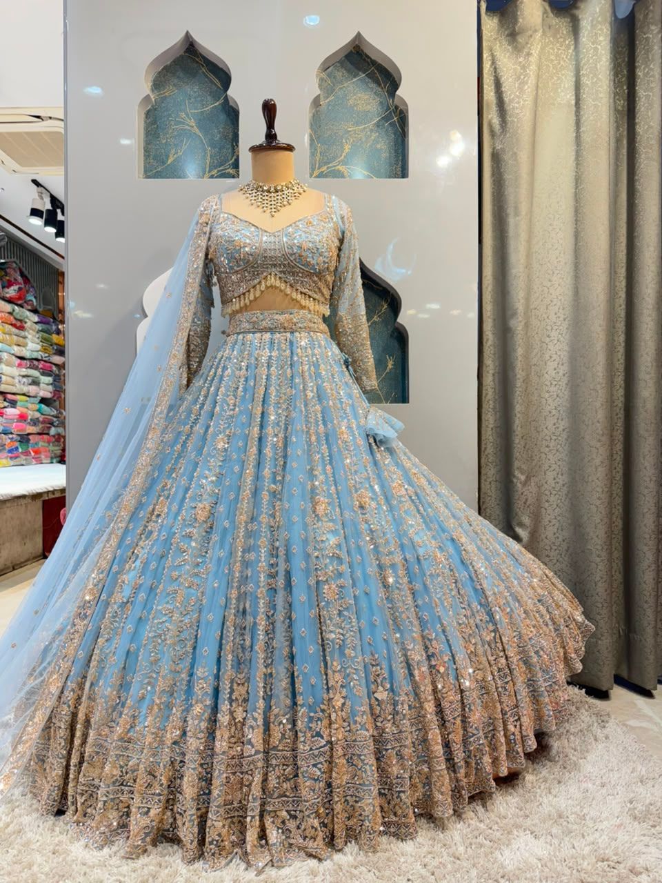 "POWDER BLUE AND GOLD EMBROIDERED LEHENGA"