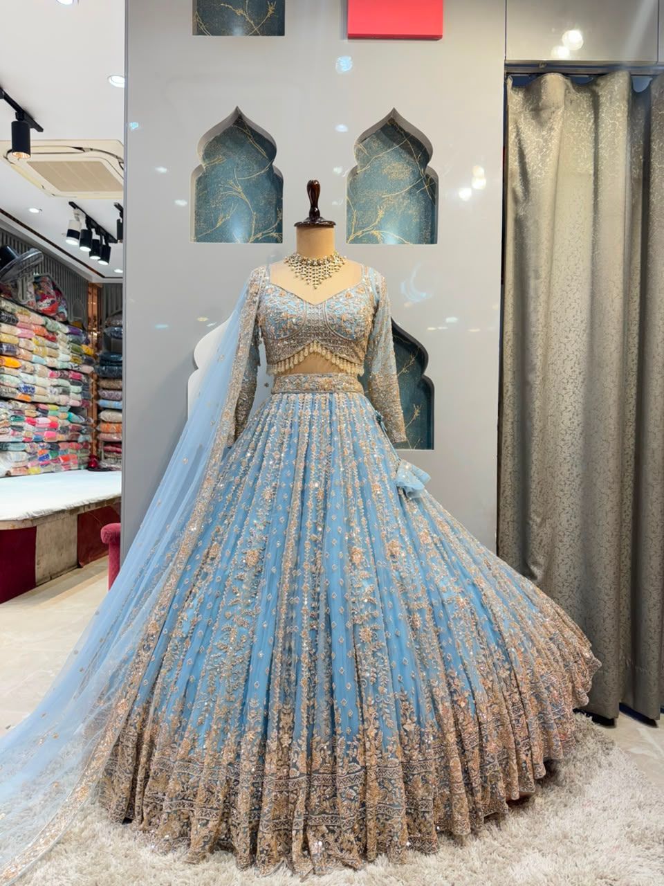 "POWDER BLUE AND GOLD EMBROIDERED LEHENGA"