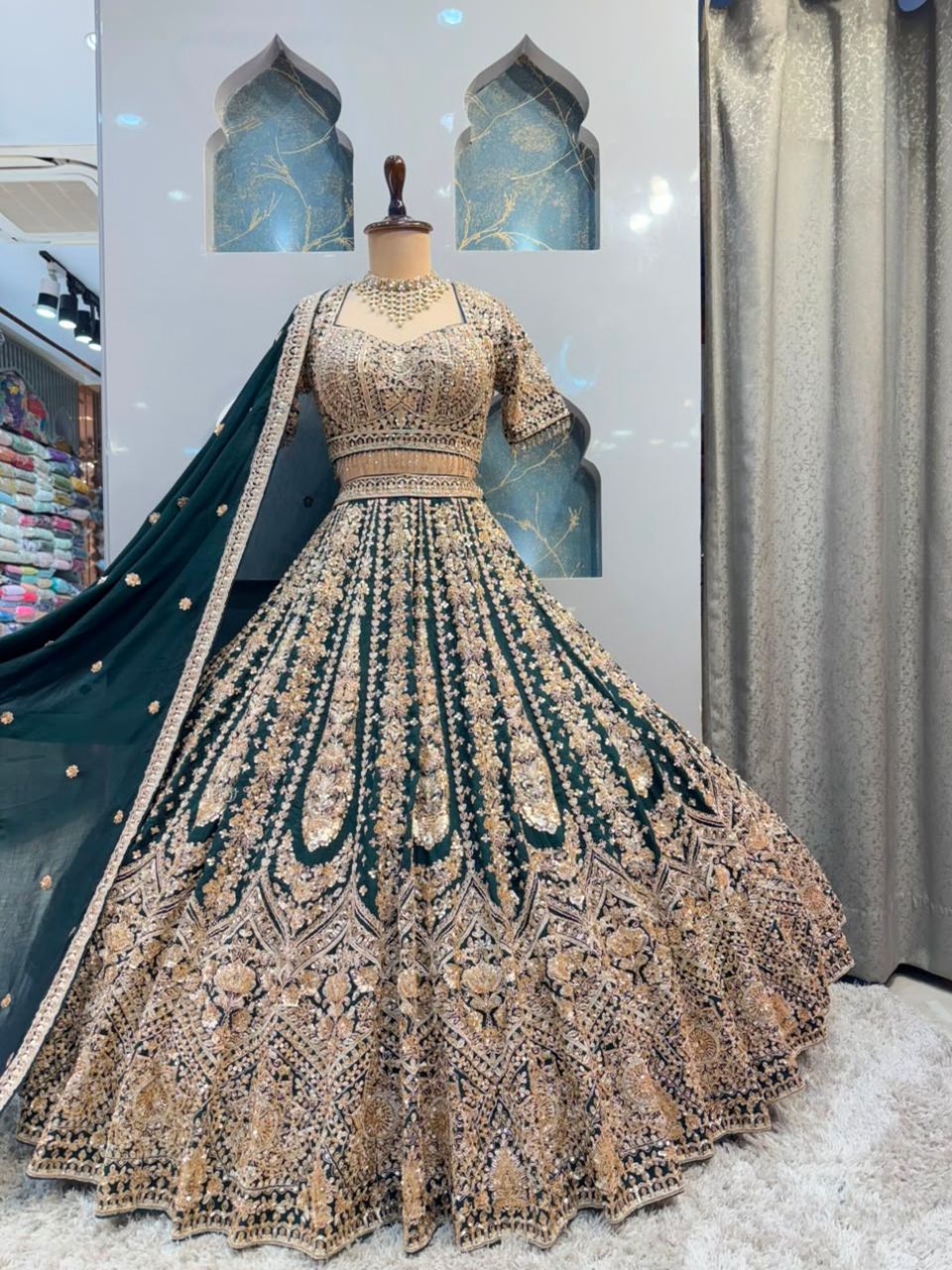 "EMERALD GREEN AND ANTIQUE GOLD EMBROIDERED LEHENGA"