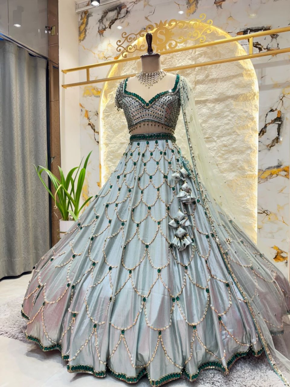 "ICY BLUE & EMERALD GREEN SCAPPLOPED LEHENGA"