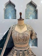 "EMERALD GREEN AND ANTIQUE GOLD EMBROIDERED LEHENGA"