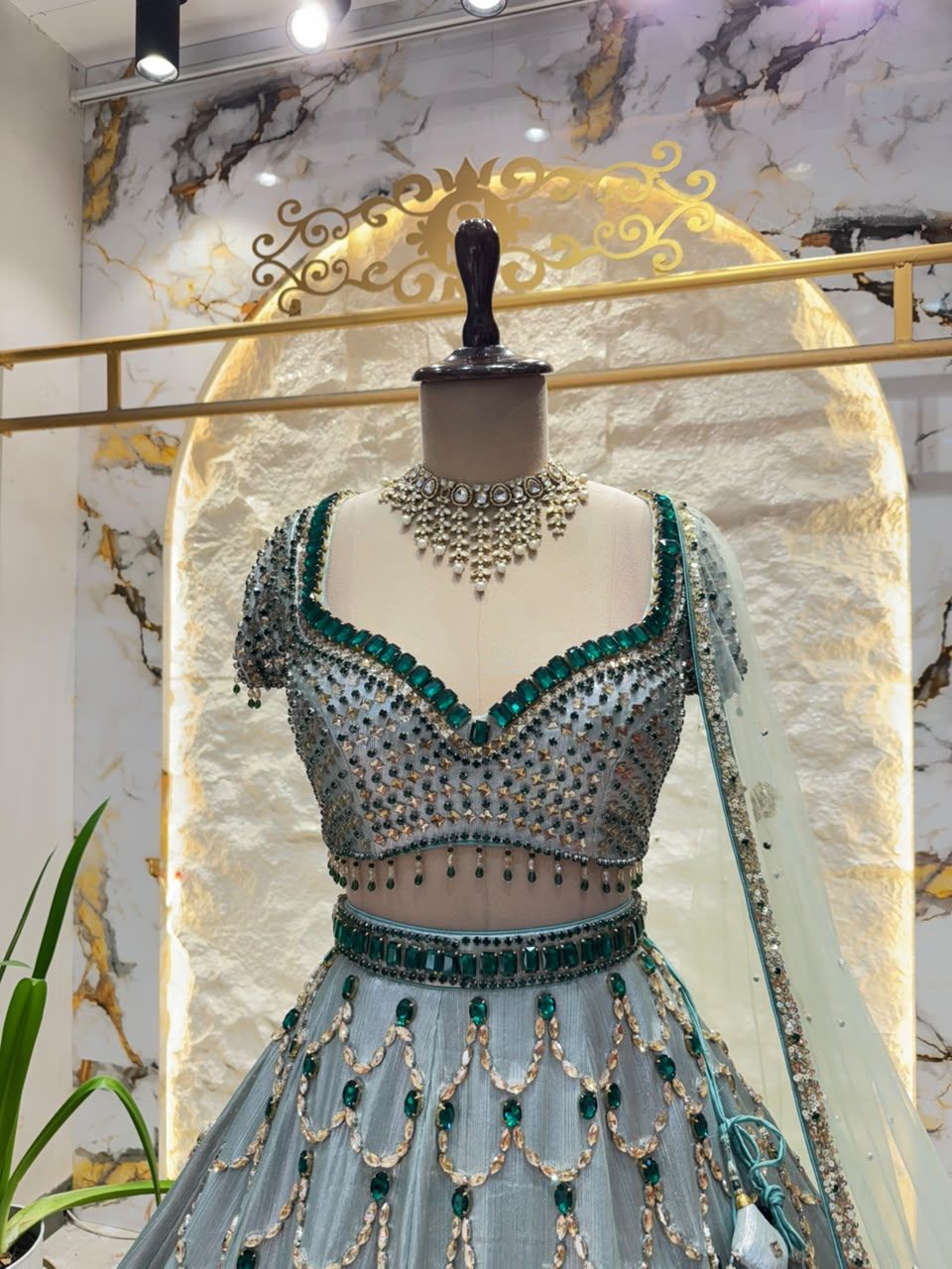 "ICY BLUE & EMERALD GREEN SCAPPLOPED LEHENGA"