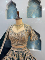 "EMERALD GREEN AND ANTIQUE GOLD EMBROIDERED LEHENGA"