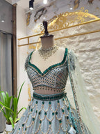 "ICY BLUE & EMERALD GREEN SCAPPLOPED LEHENGA"