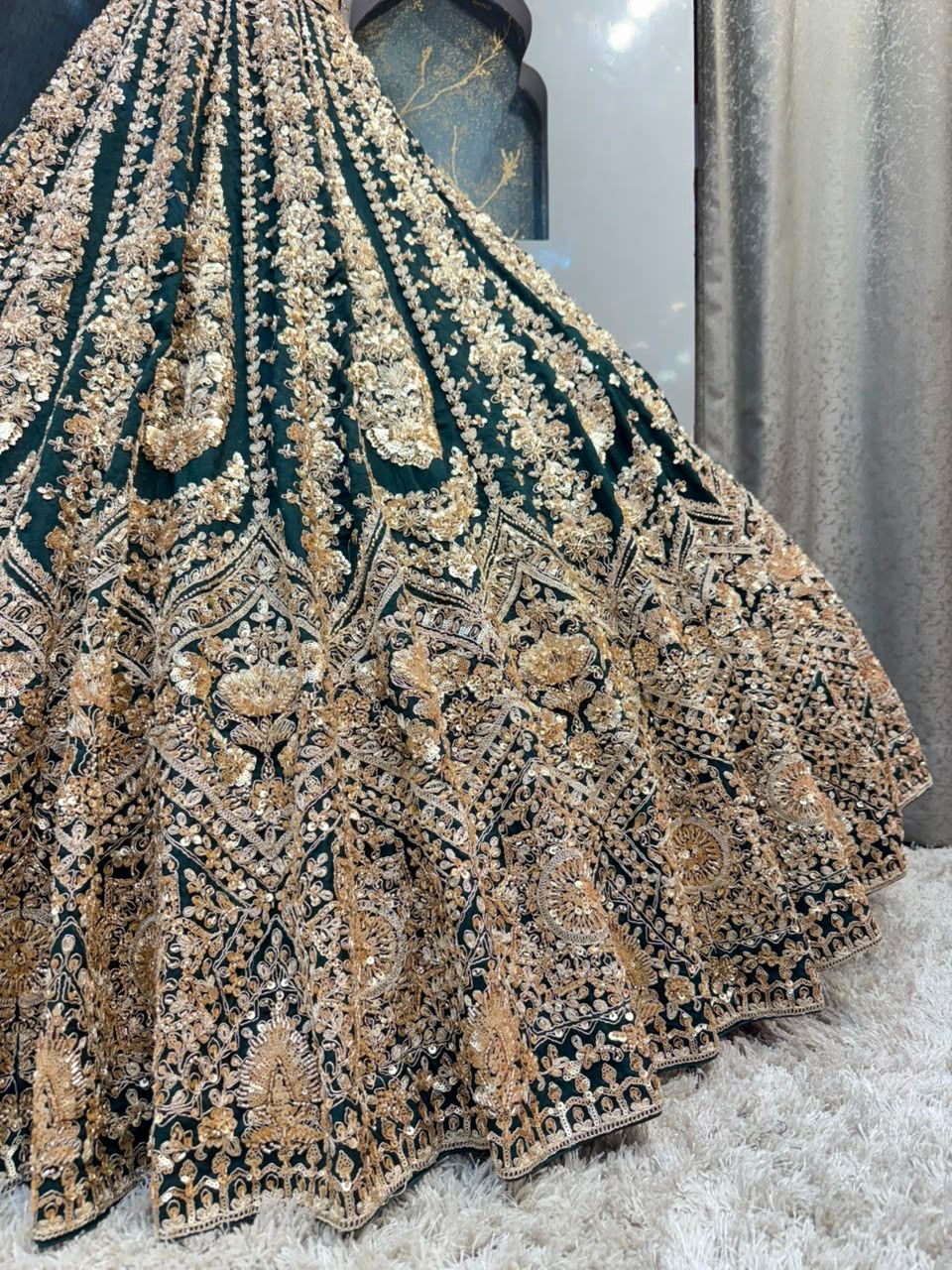 "EMERALD GREEN AND ANTIQUE GOLD EMBROIDERED LEHENGA"