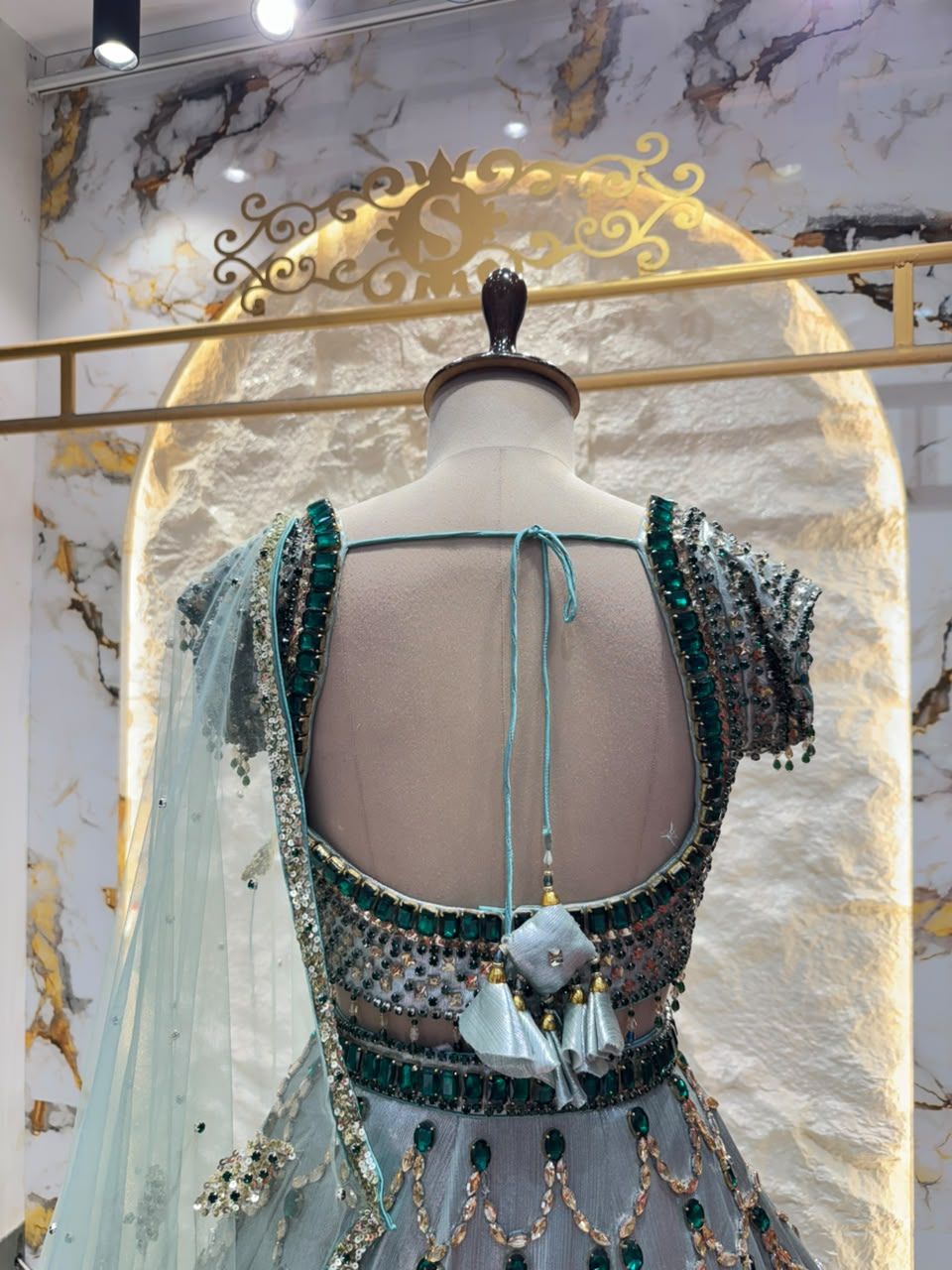 "ICY BLUE & EMERALD GREEN SCAPPLOPED LEHENGA"