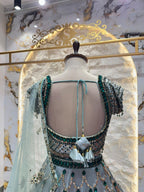 "ICY BLUE & EMERALD GREEN SCAPPLOPED LEHENGA"